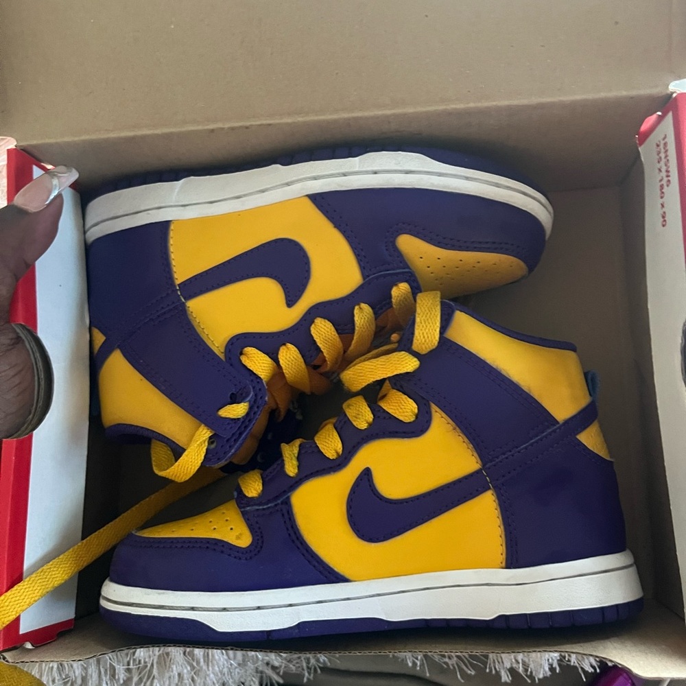 Like new Nike dunk high sneakers in a bright purple and yellow.